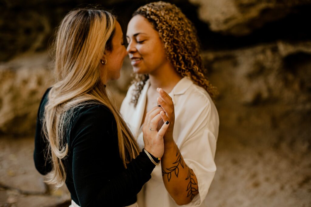 An Indiana Photographer captures two women snuggling in west lafayette, Indiana at their LGBTQ session. 