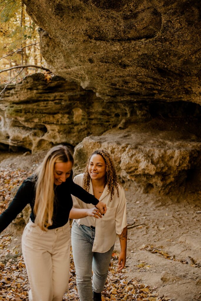 An Indiana Photographer captures two women holding hands in west lafayette, Indiana at their LGBTQ session. 
