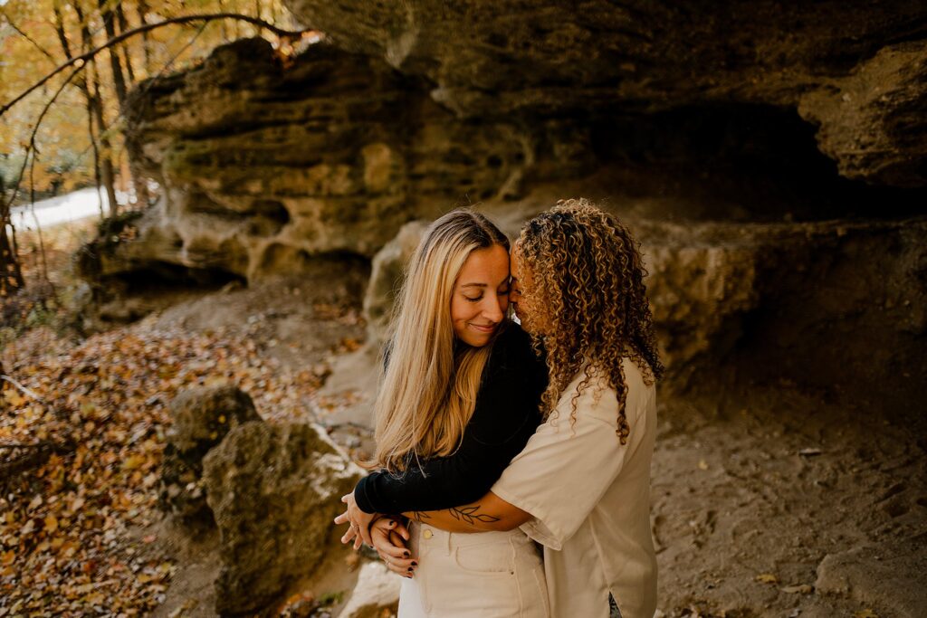 An Indiana Photographer captures two women snuggling in west lafayette, Indiana at their LGBTQ session. 