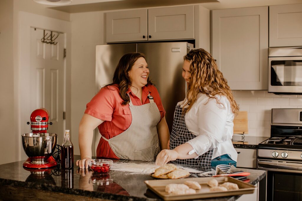 indianapolis indiana engagement photographer captures an lgbtq couple baking in their kitchen in indianapolis, indiana
