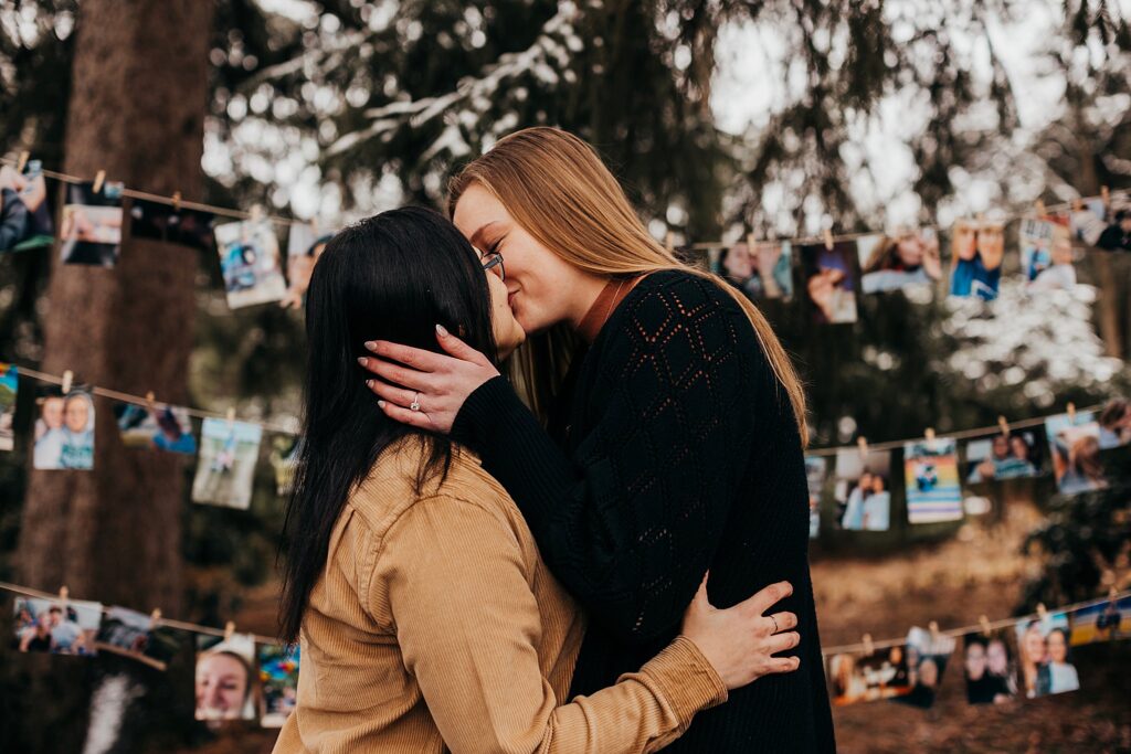 two women hold onto each others faces and kiss right after their proposal at their lgbtq proposal session in west lafayette indiana