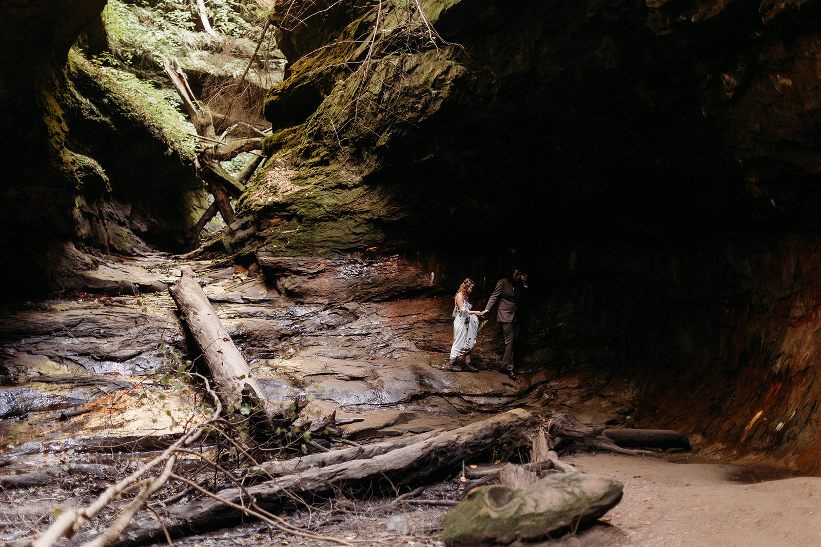 A women and man walk hand in hand at their Turkey Run Wedding in Indiana at Turkey Run State Park